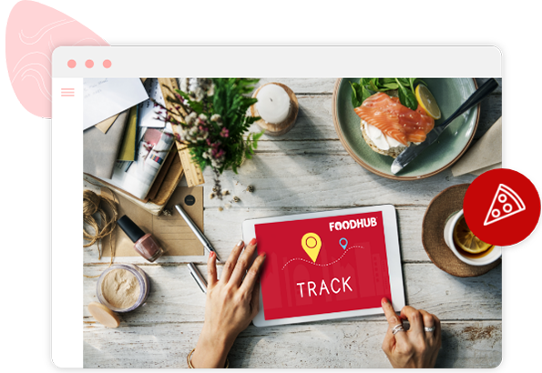 A beautiful meal of cooked salmon upon a table next to a tablet showing, Foodhub customer tracking screen, on a branded website.